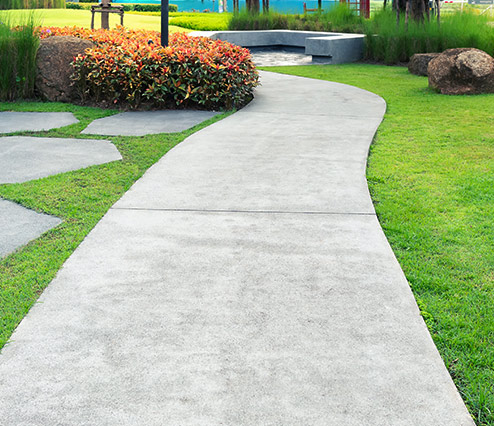 concrete walkway on a houses backyard campobello sc